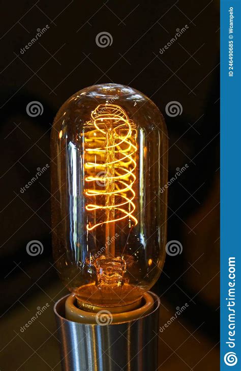 Close Up Of A Glowing Incandescent Light Bulb Filaments Stock Image