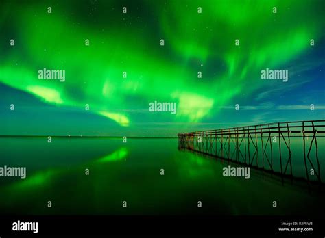 Canada, Manitoba, Winnipeg. Northern Lights reflected in Lake Winnipeg ...