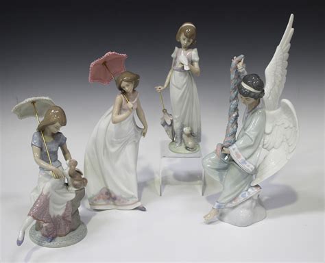 Four Lladro Porcelain Figures Comprising Angel With Garland Model No 6133 Picture Perfect Model