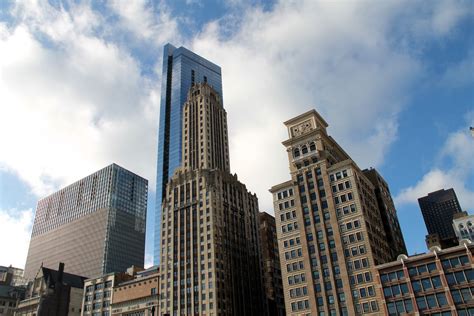 Free Stock Photo of Old & New Buildings in Sky with Clouds