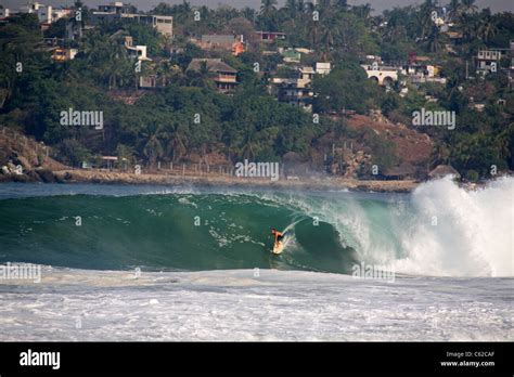 Surfing At The Mexican Pipeline On Zicatela Beach At Puerto Escondido