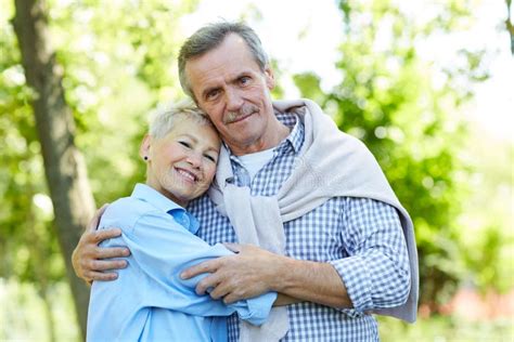 Happy Senior Couple Embracing In Park Stock Image Image Of Enjoying Love 153878269