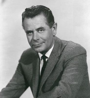 A Black And White Photo Of A Man In A Suit