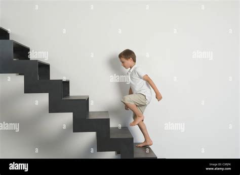 Germany Boy 4 5 Years Moving Up From Stairs Stock Photo Alamy