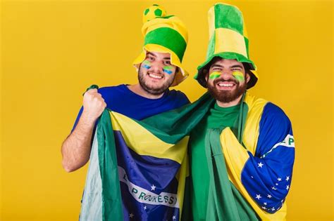 Premium Photo | Two friends brazilians soccer fans from brazil cheering ...