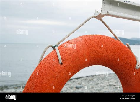 Orange Lifebuoy On The Sea Coast Stock Photo Alamy