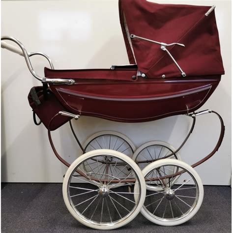 A Beautiful Burgundy Silver Cross Doll S Pram With Matching Bag