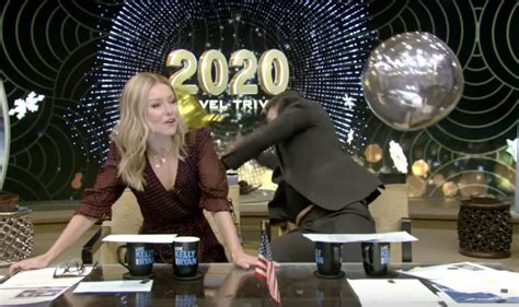 Ryan Seacrest Falls Out Of His Chair Trying To Catch A Balloon On Live