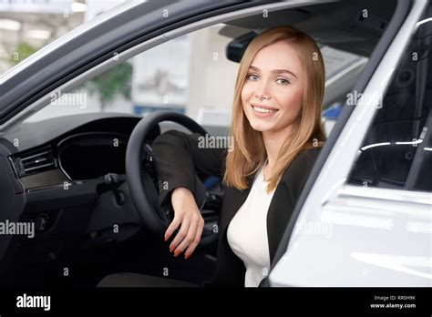 Beautiful Woman With Blonde Hair Standing Near Expensive Automobile With Opened Door Female