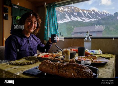Smiling Brunette Woman Toasting To A Beautiful Day In A Camper Van Stock Photo Alamy