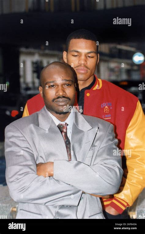 Ugandan Boxer John The Beast Mugabi In Grey Suit Poses With His