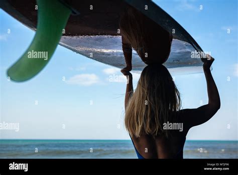 Girl In Bikini With Surfboard Walk On Black Sand Beach Surfer Woman