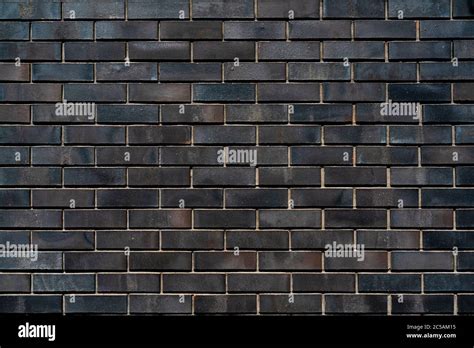 Black brick wall of building. Brick texture. Architectural abstract black background Stock Photo ...