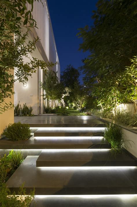 Entrance Staircase Lit Up At Night In Modern Lb House By Shachar