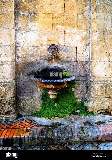 Fountain in the Medieval town of Sovana - Tuscany, Italy Stock Photo ...