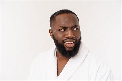 Free Photo African American Man Wearing A Bathrobe With Surprise And