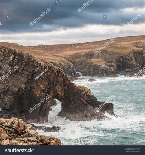 Natural Archway On Scottish Coastlinea Stormy Day On North Scottish