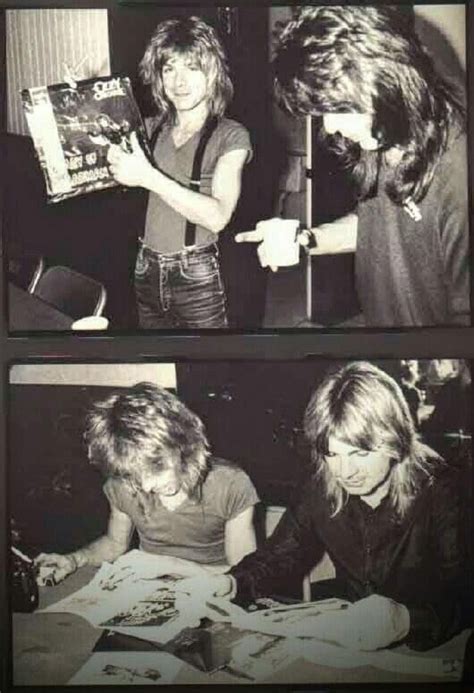 Two Women Are Looking At Pictures In Black And White While One Woman