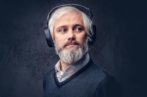 Free Photo Close Up Portrait Of A Handsome Senior Man Listening To