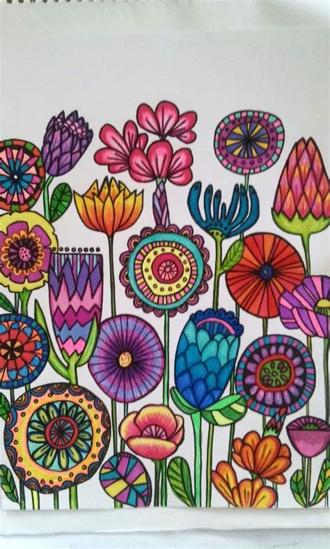 A Drawing Of Colorful Flowers On White Paper