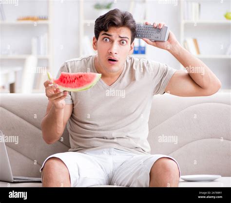 The Man Eating Watermelon At Home Stock Photo Alamy