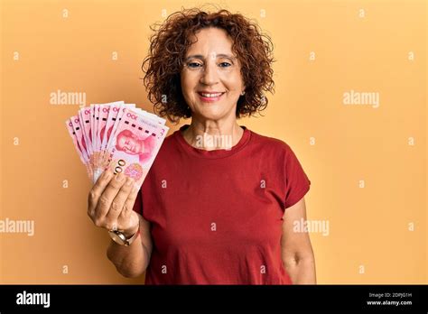 Beautiful Middle Age Mature Woman Holding Yuan Chinese Banknotes