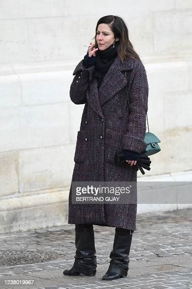 French Actress Anna Mouglalis Smokes A Cigarette As She Leaves News