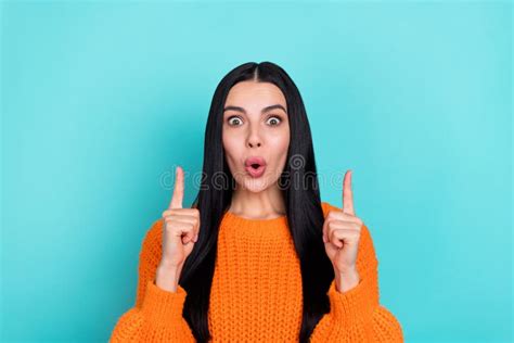 Photo Of Adorable Impressed Woman Wear Orange Sweater Pointing Fingers