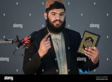 Muslim Man Reading Holy Quran Holy Quran In Hand With Arabic Text