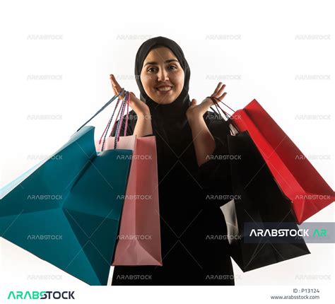 Portrait Of A Saudi Arabian Gulf Woman Carrying Shopping Bags Buying