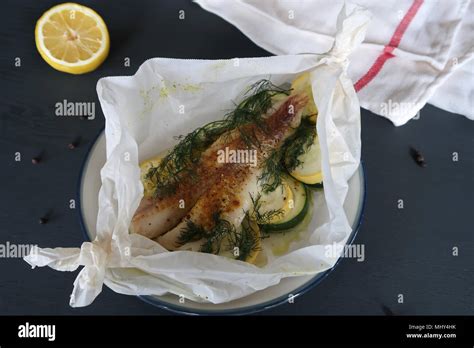 Fish En Papillote Fish Baked In Parchment Paper Stock Photo Alamy