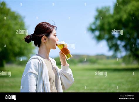 Japanese Woman Drinking Beer Stock Photo Alamy