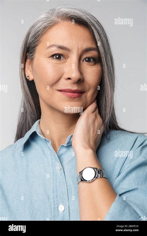 Portrait Of An Elegant Smiling Beautiful Mature Lady With Long Gray