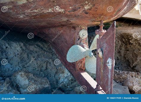 Close Up Of A Rudder And A Rusty Propeller Of A Dry Wooden Old B Stock