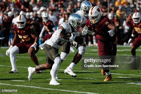 Oregon Ducks Running Back Bucky Irving Runs The Ball During The News