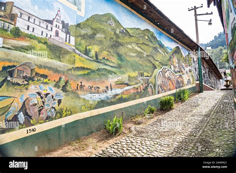 A mural painted on a building celebrating the history of Angangueo, Michoacan, Mexico. Angangueo ...