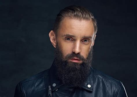 Premium Photo Close Up Portrait Of Bearded Male Wearing Black Leather