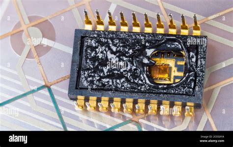 Inside Of Burned Integrated Circuit On Flexible PCB Membrane Detail