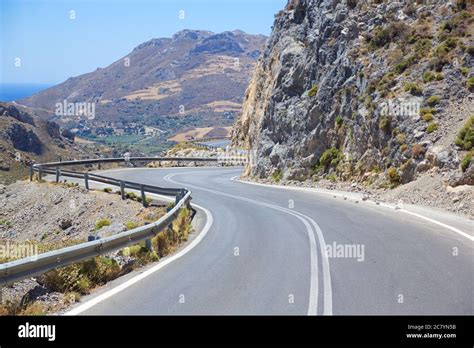 Winding Asphalt Road Leading To The Mountains Stock Photo Alamy