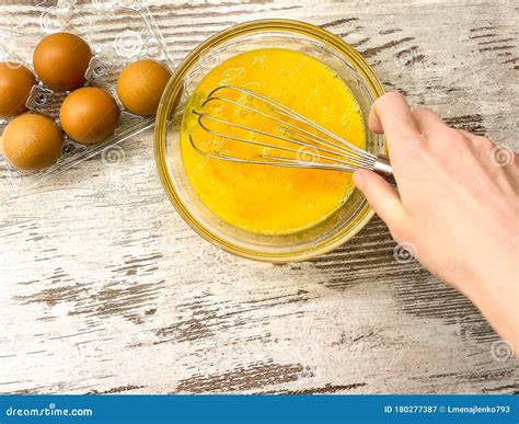 large glass bowl   process  beating eggs  cooking stock