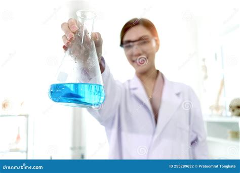 Hand Of Beautiful Asian Female Scientist Wear Lab Coats And Safety Glasses Happy Smiling