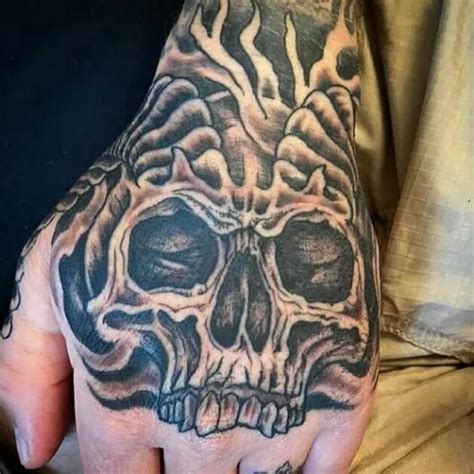 50 Skull Hand Tattoo Designs With Meaning Art And Design