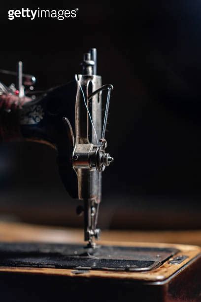 Old Sewing Machine Stands On The Table At Home Ready To Work And Sew