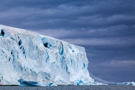 Dark Clouds Above Large Iceberg In Antarctica Fine Art Print | Photos ...