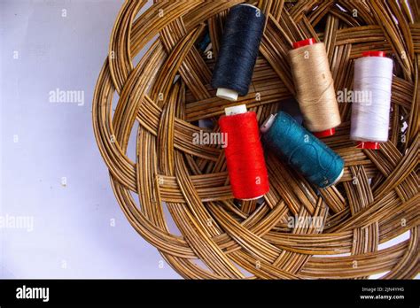 Sewing Thread Spool Of Thread With A Needle In Basket Isolated On