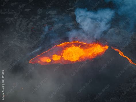 Awesome close up view of boiling red lava lake inside the active ...