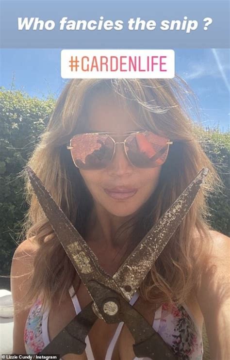 Lizzie Cundy Puts On A VERY Busty Display In A Hot Pink Sports Bra As She Works Out At Home