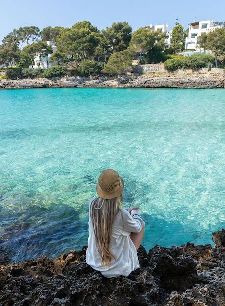 Premium Photo Rear View Of Blonde Woman In Cala D39or Cala Gran Mallorca Balearic Islands