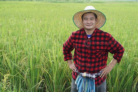 Handsome Asian Man Farmer Is At Paddy Field Wears Hat Red Plaid Shirt