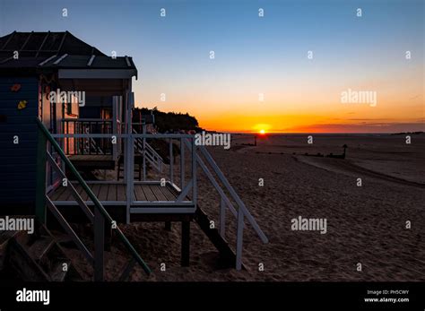 Beach huts on Holkham beach at sunset Stock Photo - Alamy